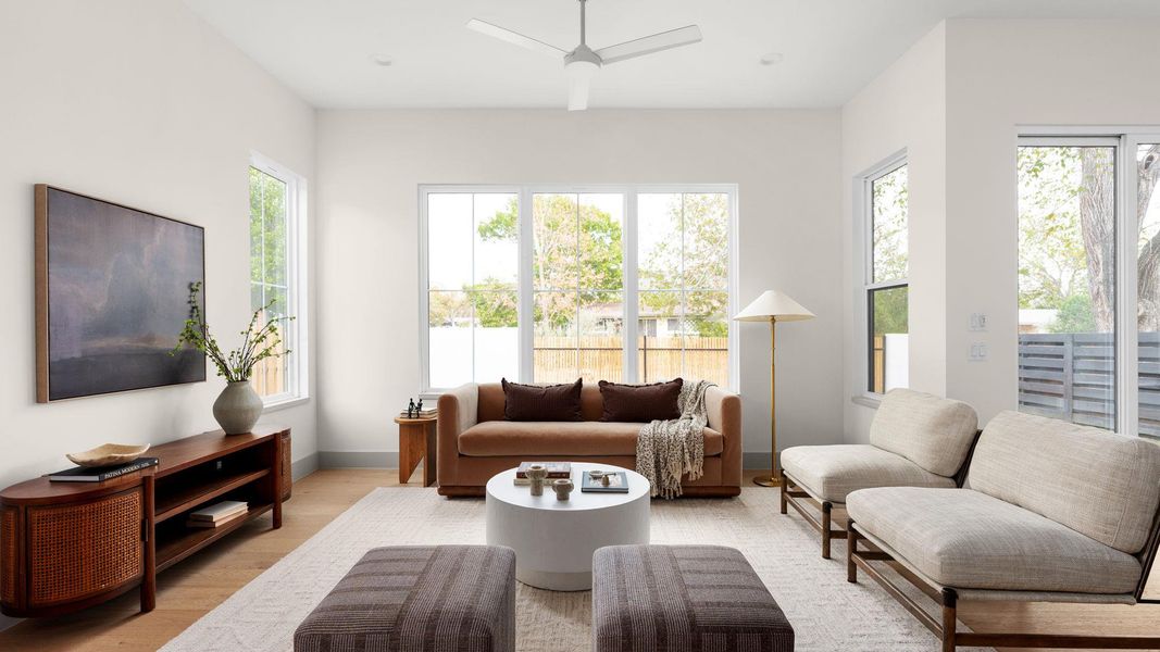 Living area featuring a ceiling fan and wood finished floors