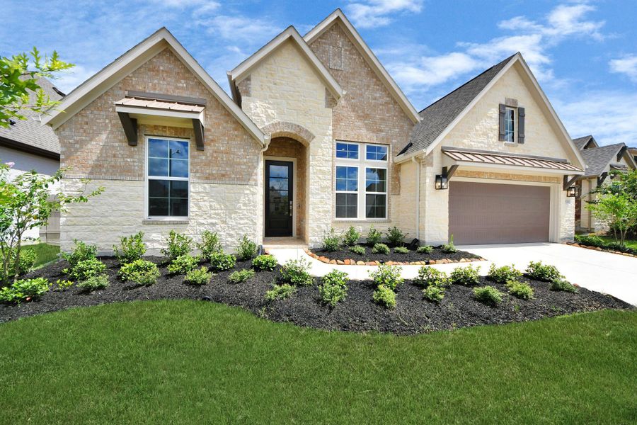 Front exterior of a new home in ARTAVIA: Hilltop Collection, Conroe, TX, highlighting curb appeal (Image 20). Front exterior of a new home in ARTAVIA: Hilltop Collection, Conroe, TX, highlighting curb appeal (Image 20).