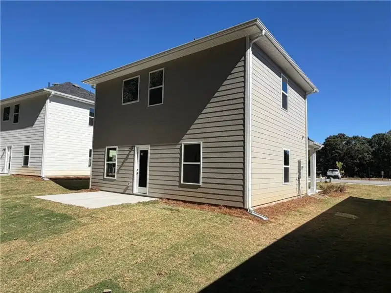 Exterior details and patio area of a home in Canterbury Villas, Carrollton (Image 4).
