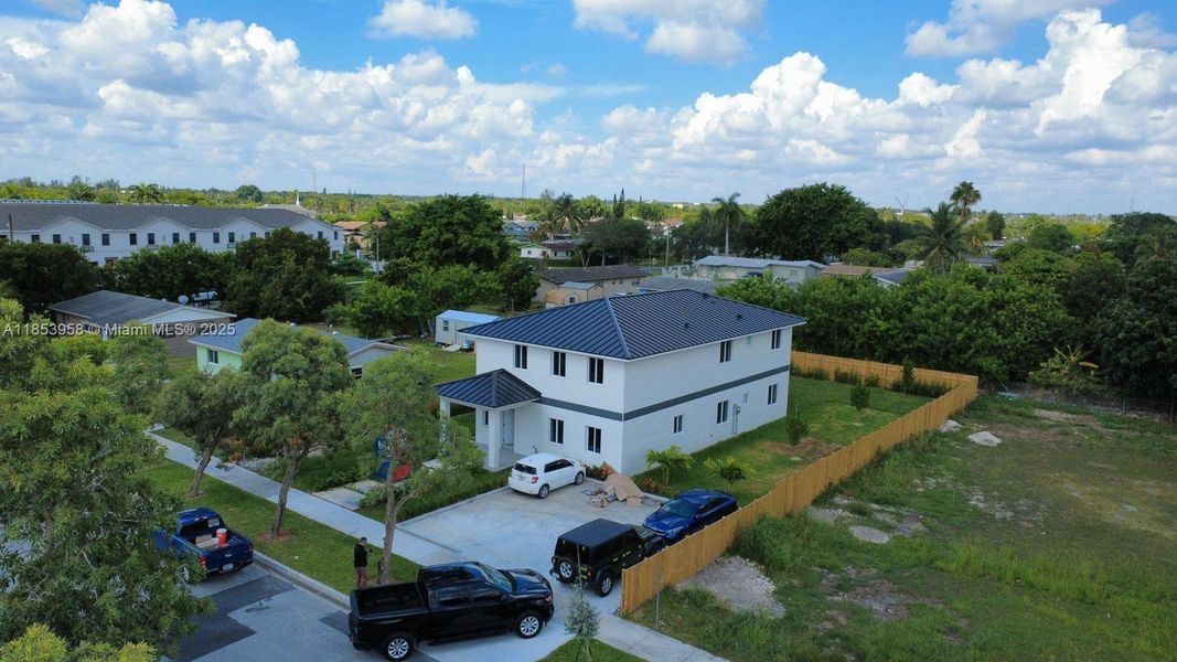 Front exterior of a new home in , Florida City, FL, highlighting curb appeal (Image 17). Front exterior of a new home in , Florida City, FL, highlighting curb appeal (Image 17).