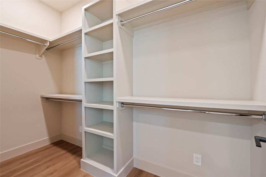 1 of 2 spacious walk-in closets with custom built-ins for this Primary 1 of 2 spacious walk-in closets with custom built-ins for this Primary