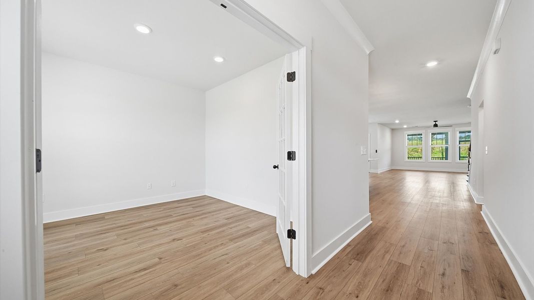 Superior design begins at the front door with a hardwood floor foyer and elegant sightlines in Woodruff, SC
