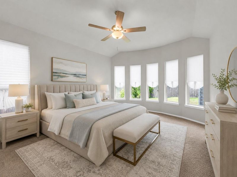 The primary bedroom features a vaulted ceiling with a modern fan and a distinctive curved wall lined with five tall windows.**Virtually staged The primary bedroom features a vaulted ceiling with a modern fan and a distinctive curved wall lined with five tall windows.**Virtually staged