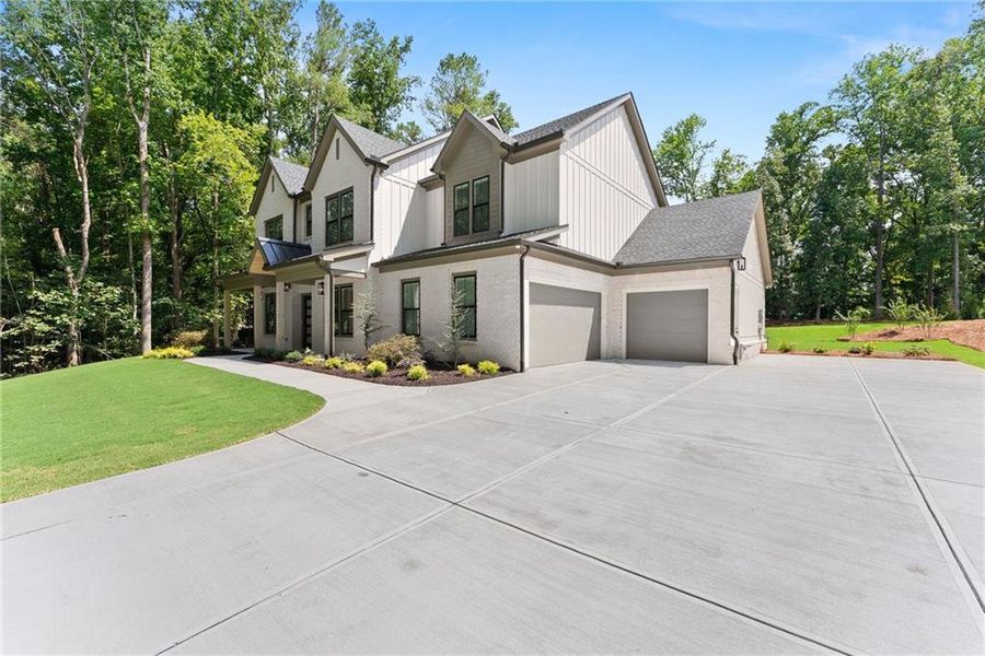 Front exterior of a new home in , Cumming, GA, highlighting curb appeal (Image 28).