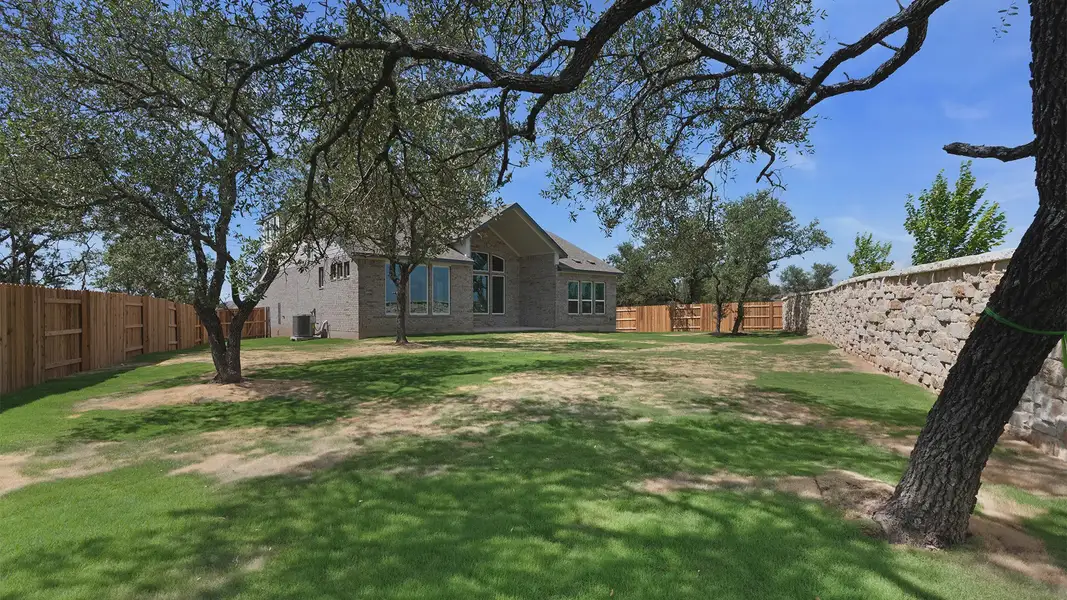 Exterior details and patio area of a home in Lariat, Liberty Hill (Image 4).