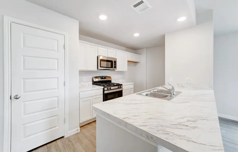 Front exterior of a new home in Courtland Place, Cleburne, TX, highlighting curb appeal (Image 3). Front exterior of a new home in Courtland Place, Cleburne, TX, highlighting curb appeal (Image 3).