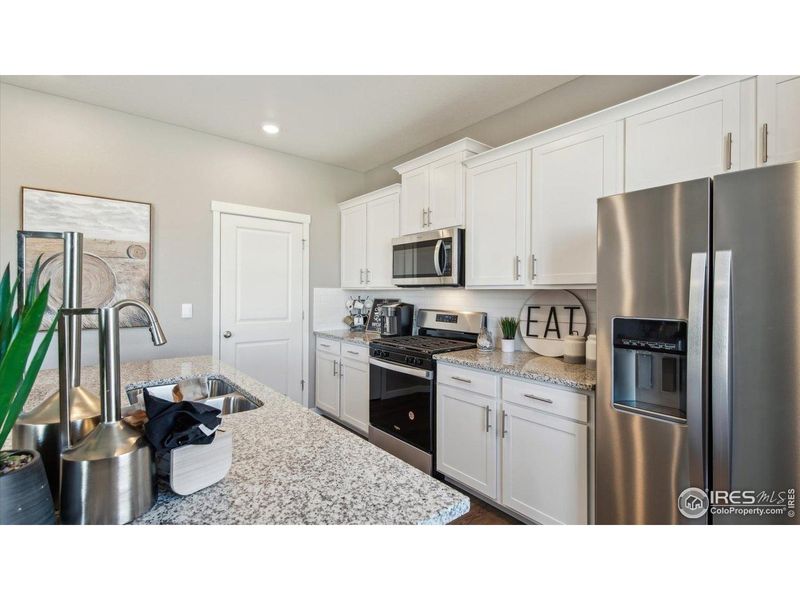 Furnished interior view inside a new home in Vista Meadows, Fort Lupton (Image 6).