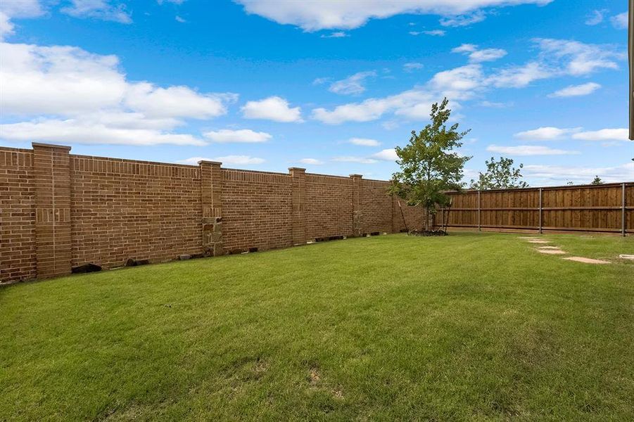 Exterior details and patio area of a home in , Little Elm (Image 27). Exterior details and patio area of a home in , Little Elm (Image 27).