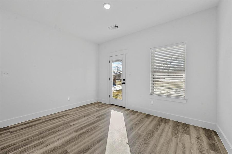 Unfurnished room featuring light wood-type flooring