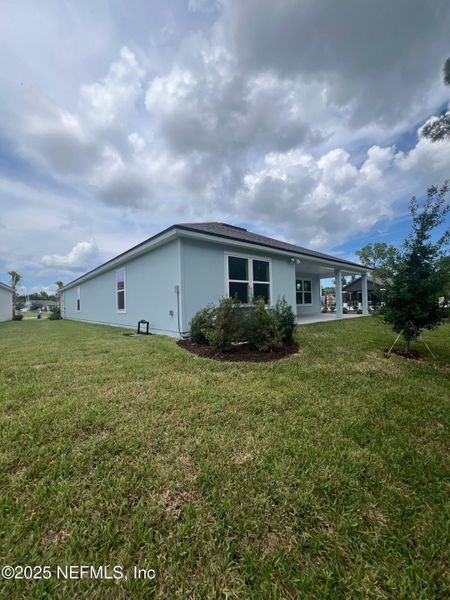 Front exterior of a new home in American Village, Palm Coast, FL, highlighting curb appeal (Image 20). Front exterior of a new home in American Village, Palm Coast, FL, highlighting curb appeal (Image 20).