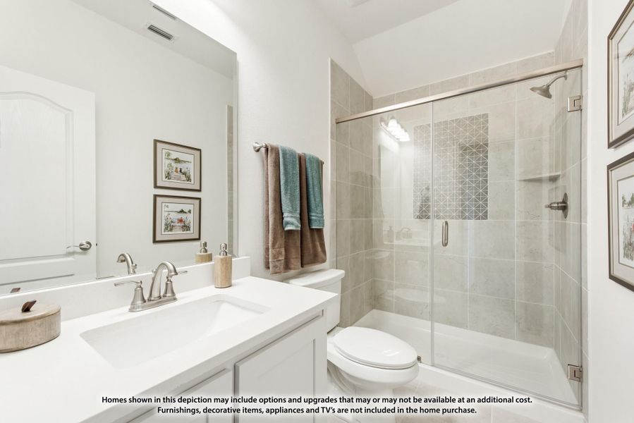 Bathroom with white vanity, large mirror, and glass-enclosed tile shower Bathroom with white vanity, large mirror, and glass-enclosed tile shower