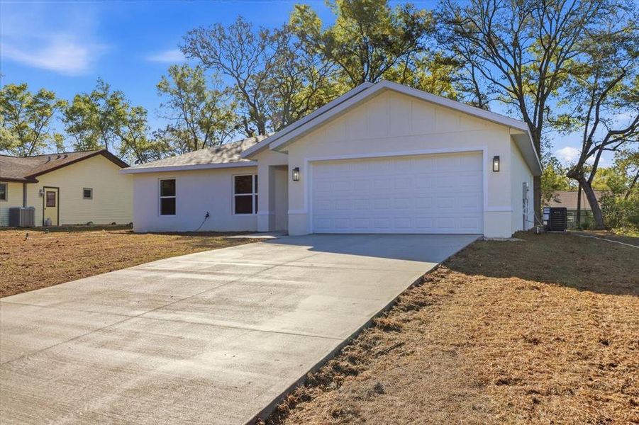 Front exterior of a new home in , Citrus Springs, FL, highlighting curb appeal (Image 23).