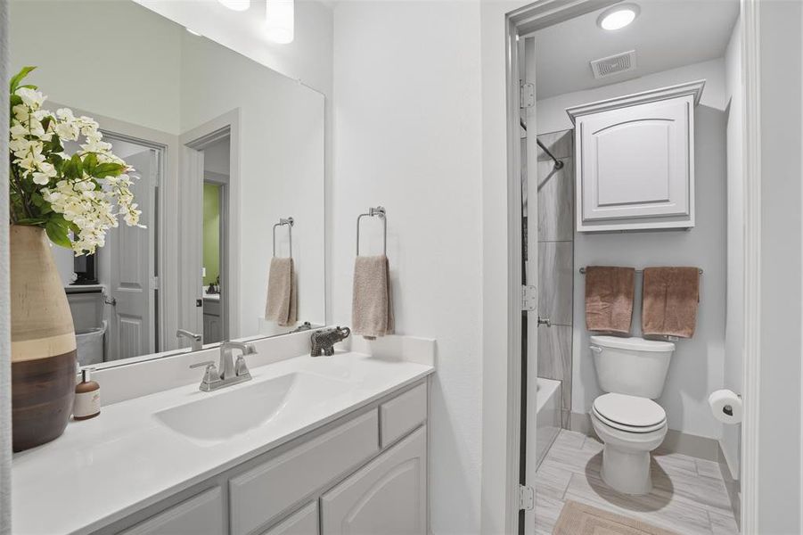 Full bathroom with shower / bath combo with shower curtain and vanity Full bathroom with shower / bath combo with shower curtain and vanity