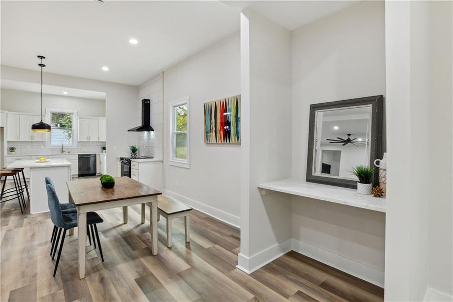 Dining area featuring sink and Luxury Vinyl Plank flooring