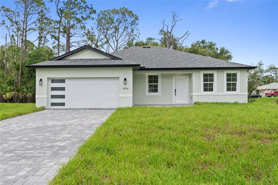Front exterior of a new home in , North Port, FL, highlighting curb appeal (Image 1).