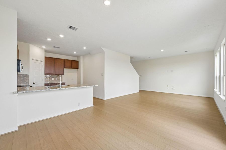Beautiful open-concept layout effortlessly uniting the living, dining, and kitchen spaces—ideal for everyday comfort and entertaining guests! Beautiful open-concept layout effortlessly uniting the living, dining, and kitchen spaces—ideal for everyday comfort and entertaining guests!