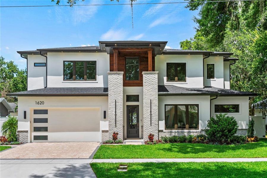 Front exterior of a new home in , Orlando, FL, highlighting curb appeal (Image 1). Front exterior of a new home in , Orlando, FL, highlighting curb appeal (Image 1).