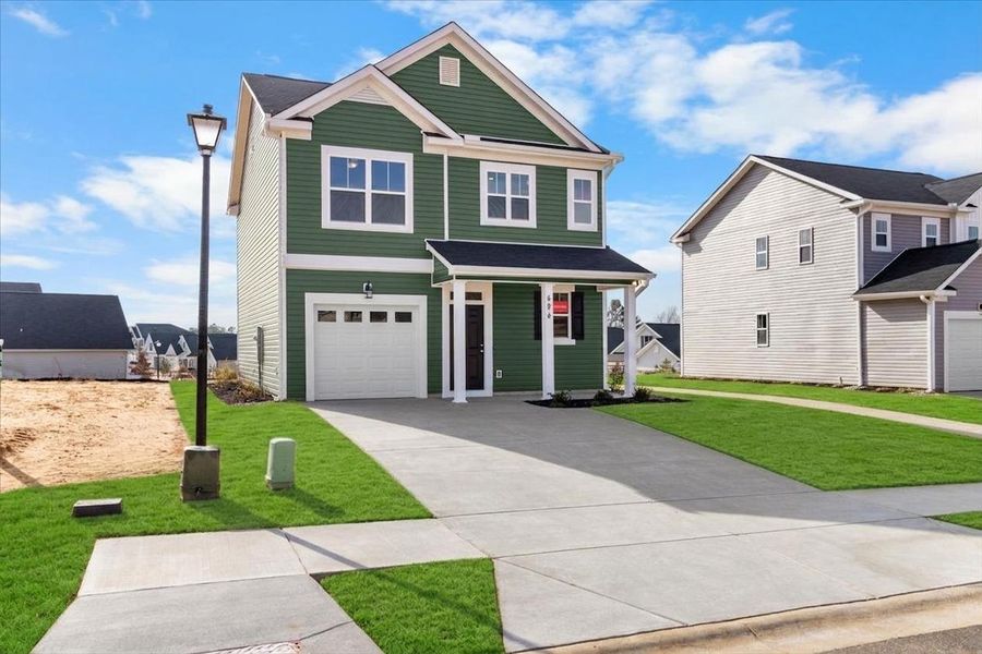Front exterior of a new home in Windsor, North Augusta, SC, highlighting curb appeal (Image 23). Front exterior of a new home in Windsor, North Augusta, SC, highlighting curb appeal (Image 23).