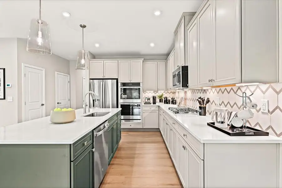 Representative furnished interior of a home built from the Roxbury Grande by Ryan Homes in Griffin Farm Townes, Pittsboro (Image 2).