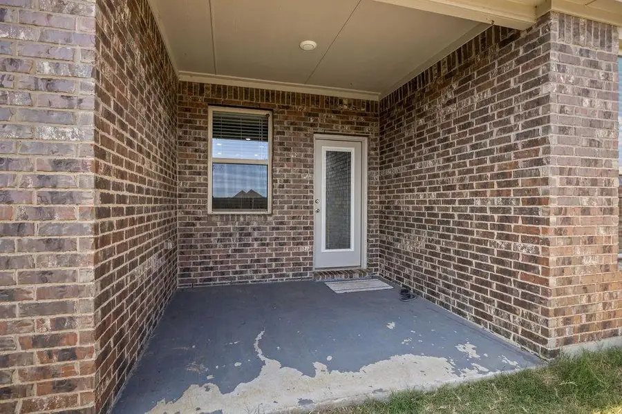 Exterior details and patio area of a home in , Aubrey (Image 3).