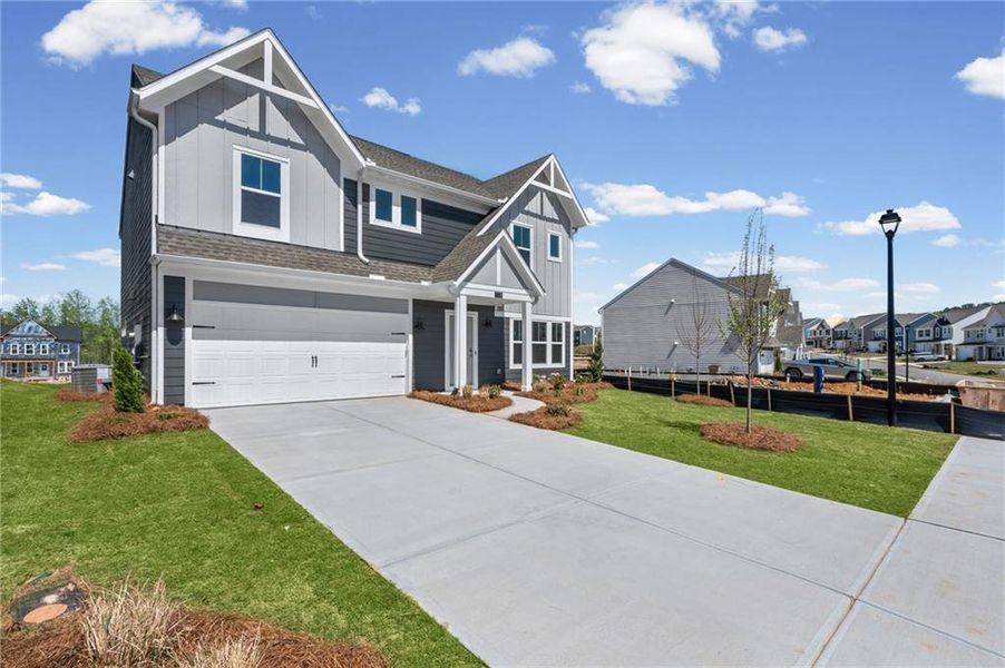 Front exterior of a new home in Twin Lakes, Hoschton, GA, highlighting curb appeal (Image 25).