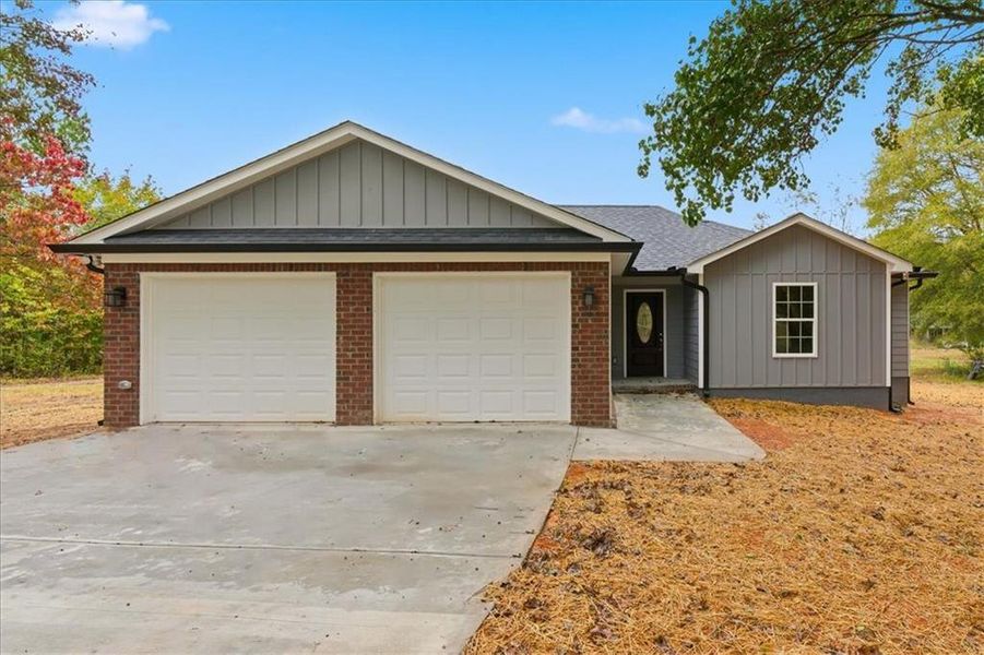 Front exterior of a new home in , Taylorsville, GA, highlighting curb appeal (Image 1).