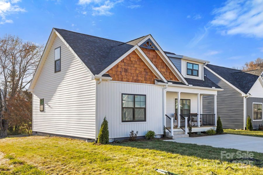 Front exterior of a new home in , Arden, NC, highlighting curb appeal (Image 1). Front exterior of a new home in , Arden, NC, highlighting curb appeal (Image 1).