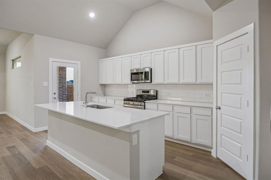 Kitchen in the Wimbledon home plan by Trophy Signature Homes – REPRESENTATIVE PHOTO Kitchen in the Wimbledon home plan by Trophy Signature Homes – REPRESENTATIVE PHOTO