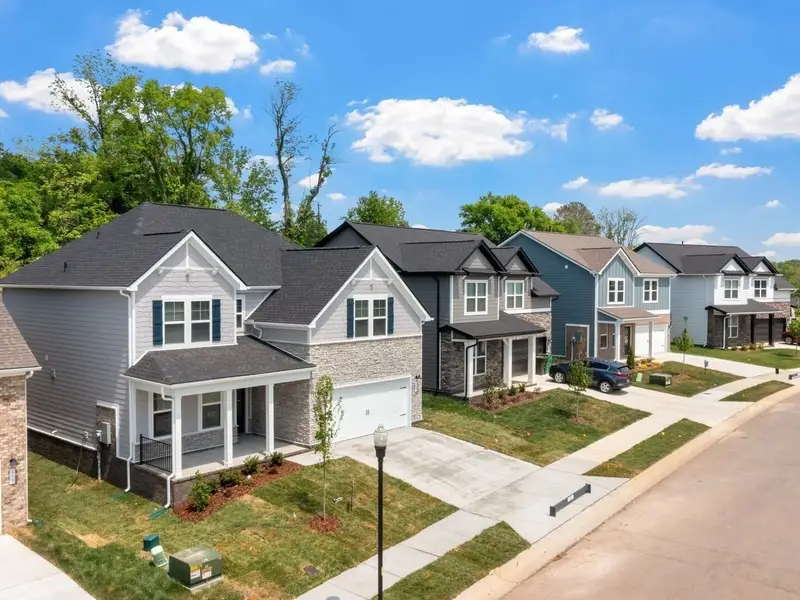 Front exterior of a new home in Woods Crossing, Gallatin, TN, highlighting curb appeal (Image 28). Front exterior of a new home in Woods Crossing, Gallatin, TN, highlighting curb appeal (Image 28).