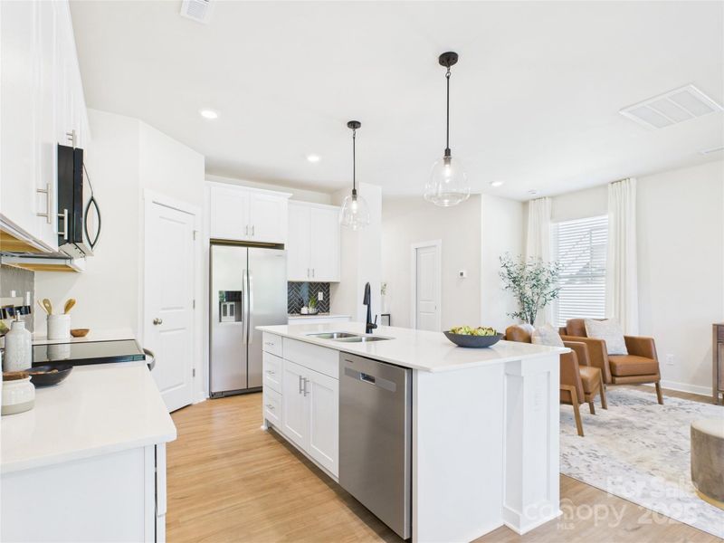 Whirlpool stainless appliances including refrigerator.