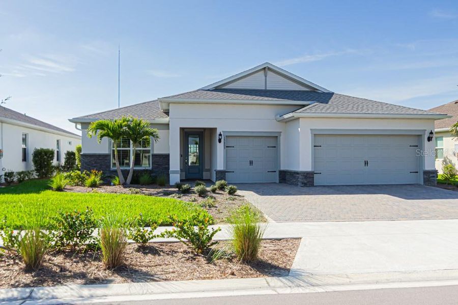 Front exterior of a new home in , Punta Gorda, FL, highlighting curb appeal (Image 26).
