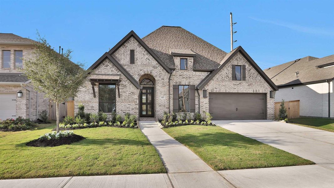 Front exterior of a new home in , Fulshear, TX, highlighting curb appeal (Image 2). Front exterior of a new home in , Fulshear, TX, highlighting curb appeal (Image 2).