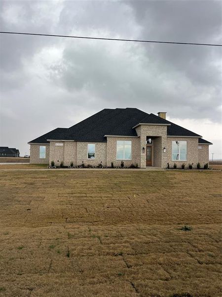 View of front of house with a front lawn