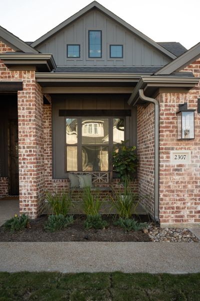 Exterior details and patio area of a home in Greens Prairie Reserve, College Station (Image 27).