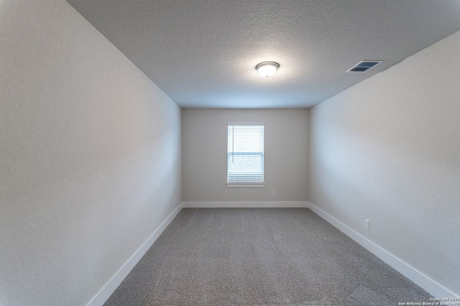 Spacious, unfurnished interior of a new home in The Woodlands at Medina Hills, Mico (Image 16).