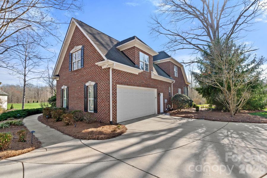 Front exterior of a new home in , Summerfield, NC, highlighting curb appeal (Image 22).