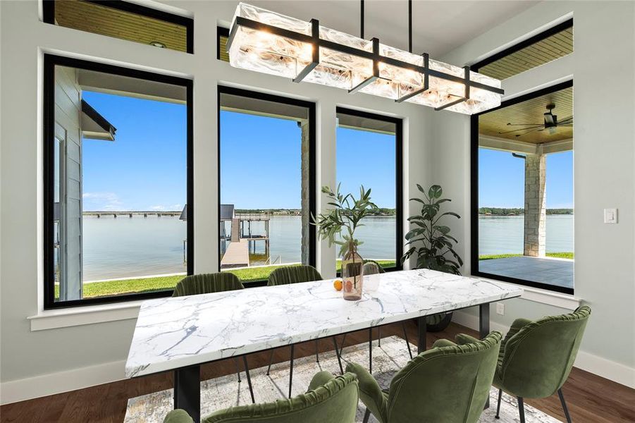 Virtually Staged- Lakeside dining with expansive windows overlooking the water.
