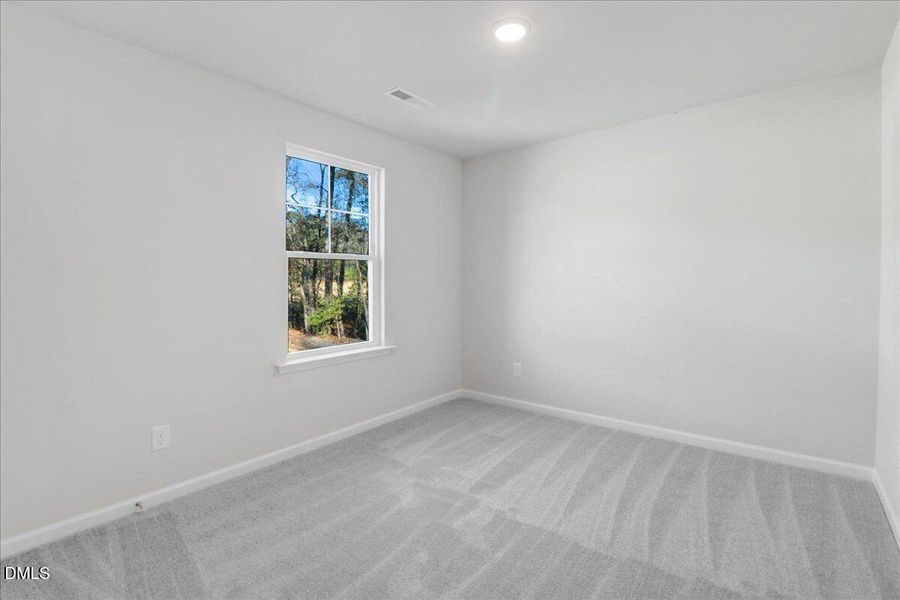 22-Bedroom with window overlooking woode