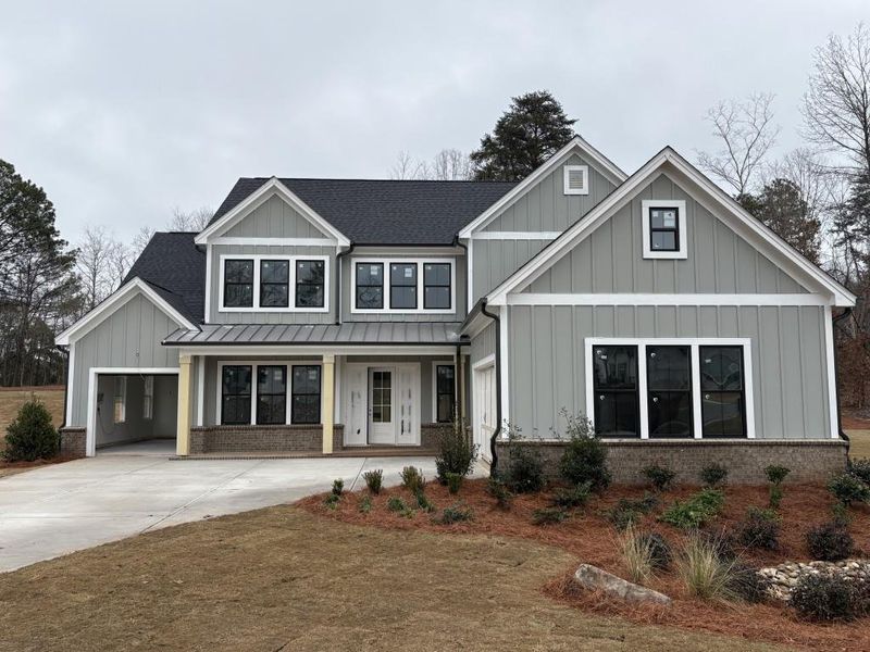 Front exterior of a new home in , Cumming, GA, highlighting curb appeal (Image 1). Front exterior of a new home in , Cumming, GA, highlighting curb appeal (Image 1).