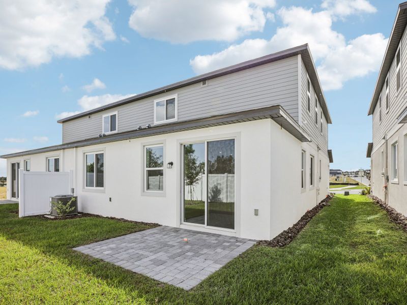 Exterior details and patio area of a home in Cyrene at Minneola - Villas, Minneola (Image 2).