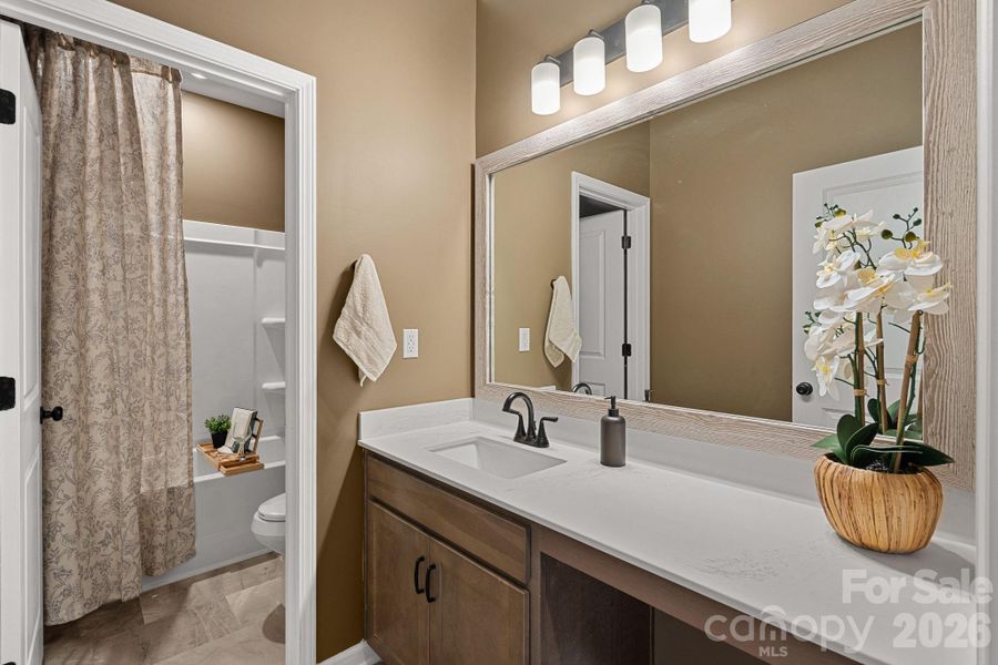 Full bath offers make-up area and shower/tub combo. Full bath offers make-up area and shower/tub combo.