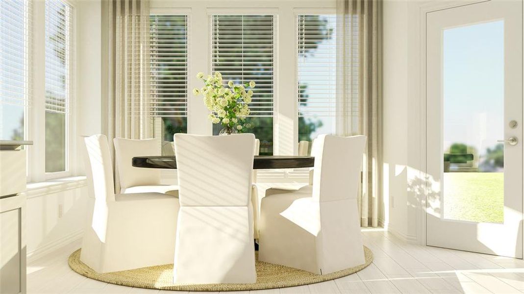 Tiled dining space featuring a wealth of natural light