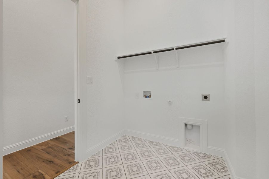 Laundry room featuring gas dryer hookup, electric dryer hookup, hookup for a washing machine, and light wood finished floors