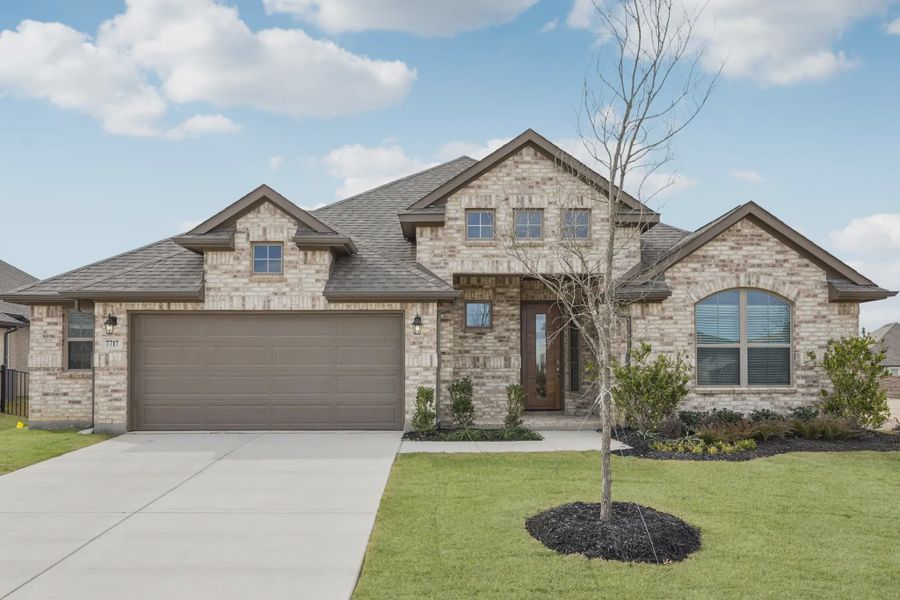Front exterior of a new home in Las Lomas, Forney, TX, highlighting curb appeal (Image 1). Front exterior of a new home in Las Lomas, Forney, TX, highlighting curb appeal (Image 1).
