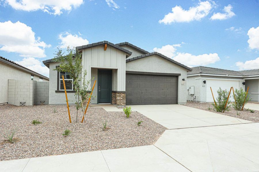 Front exterior of a new home in Skyline Village, San Tan Valley, AZ, highlighting curb appeal (Image 1). Front exterior of a new home in Skyline Village, San Tan Valley, AZ, highlighting curb appeal (Image 1).