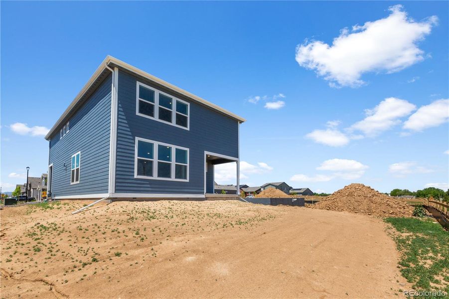 Front exterior of a new home in Granary, Johnstown, CO, highlighting curb appeal (Image 14). Front exterior of a new home in Granary, Johnstown, CO, highlighting curb appeal (Image 14).