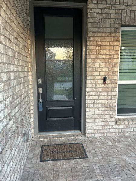 This beautiful front full glass door has a key pad entry. This beautiful front full glass door has a key pad entry.