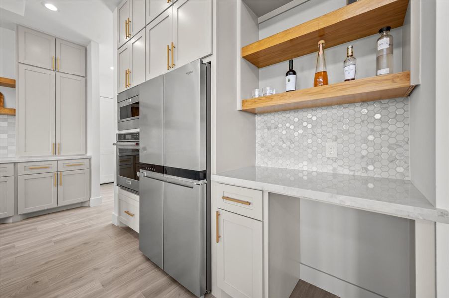 Right side of kitchen - space for a wine fridge desk area