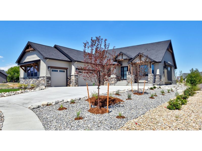Front exterior of a new home in Harvest Ridge, Berthoud, CO, highlighting curb appeal (Image 28).