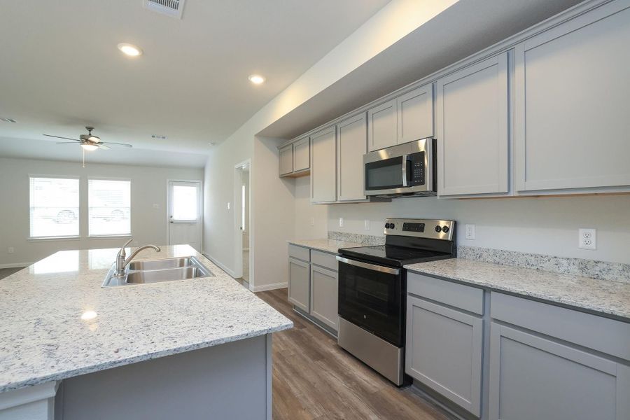 Never miss a piece of the action while you're in the Kitchen. The open concept floor plan keeps everyone connected.